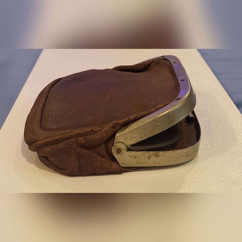 Antuque french leather coin purse with a metal clasp